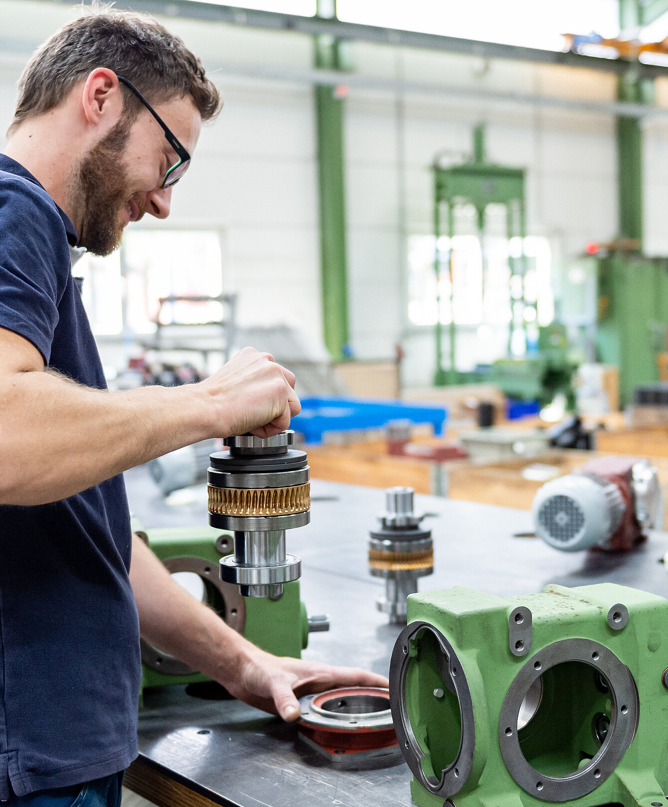 Technician assembling an electric motor in the service area